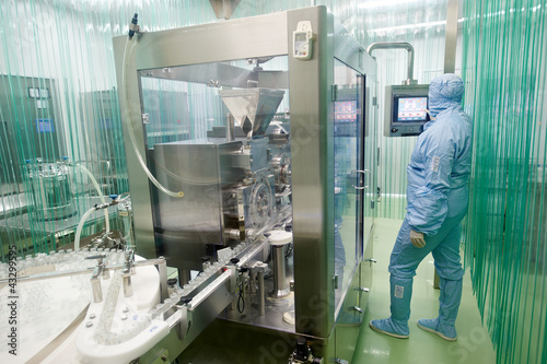 Photo: pharmaceutical factory worker pharmaceutical factory worker