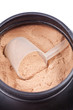 Photo: Scoop of chocolate whey isolate protein in black container Scoop of chocolate whey isolate protein in black container