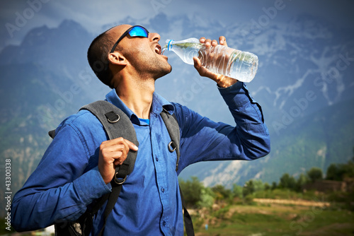 Photo: thirsty tourist drink a water thirsty tourist drink a water