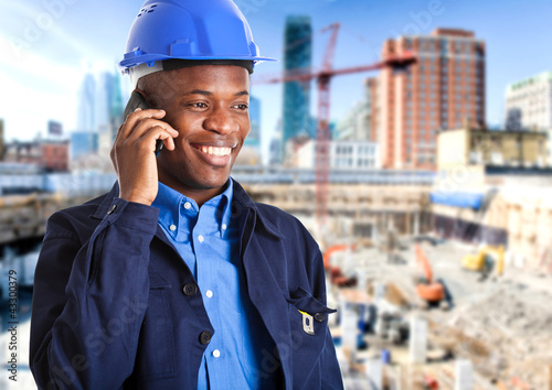 Photo: Black engineer speaking at the phone Black engineer speaking at the phone