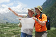 Tourist travellers with map in mountains