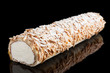 Swiss roll of whipped cream and almonds