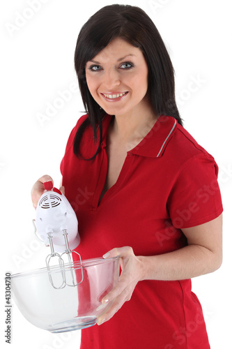 Photo: Woman with an electric whisk Woman with an electric whisk