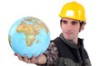 Tradesman holding a globe