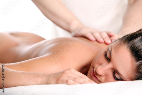 Photo: Woman enjoying a massage therapy Woman enjoying a massage therapy