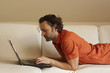 Man on a couch with a notebook