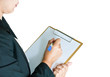 Photo: Business woman taking note on clipboard Business woman taking note on clipboard