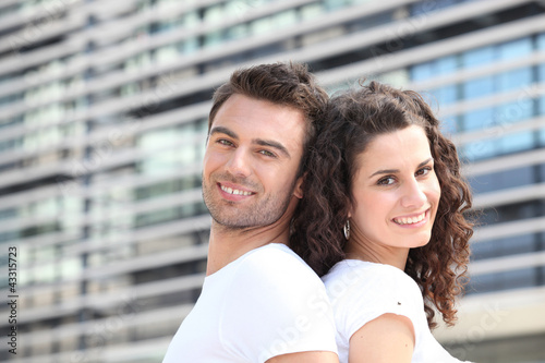 Photo: Couple outside office building Couple outside office building