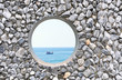 hole  on the rock wall  with ocean background