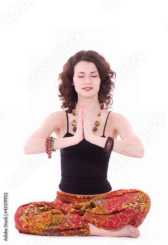 Photo: Portrait of hippie young woman doing yoga exercise Portrait of hippie young woman doing yoga exercise