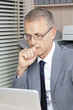focus businessman reads messages on the computer