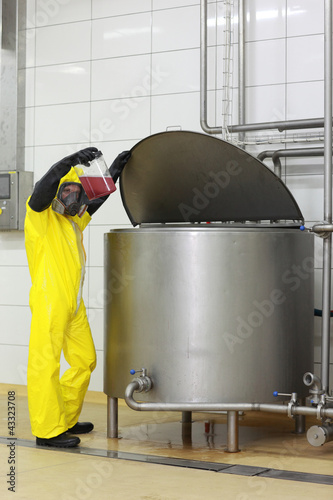 Photo: Technician examining sample Technician examining sample