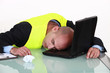 Exhausted man sleeping on his laptop