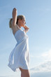 Girl with hands up outdoors