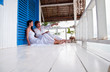Romantic young couple in tropical beach house