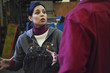 Workers talking together in factory