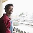 Mixed race worker standing on factory loading dock