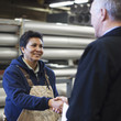 Photo: Foreman shaking hands with worker in factory Foreman shaking hands with worker in factory