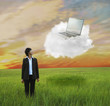 Kazakhstan businesswoman looking at laptop on cloud