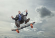 Photo: Mixed race businessman on skateboard in sky Mixed race businessman on skateboard in sky