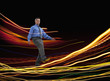 Mixed race businessman walking on glowing lines