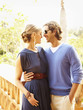 Glamorous Caucasian couple hugging outdoors