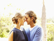 Glamorous Caucasian couple hugging outdoors