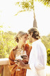 Glamorous Caucasian couple drinking red wine outdoors