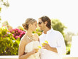 Glamorous Caucasian couple drinking cocktails outdoors