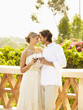 Glamorous Caucasian couple drinking red wine outdoors