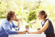 Glamorous Caucasian couple sitting in restaurant together