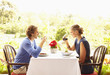Glamorous Caucasian couple eating in restaurant