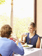 Glamorous Caucasian couple eating in restaurant