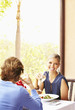 Glamorous Caucasian couple eating in restaurant