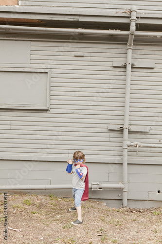 Photo: Caucasian boy dressed as superhero Caucasian boy dressed as superhero