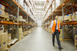 Manager walking in warehouse