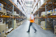 Manager walking in warehouse