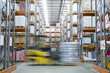 Forklift on the move in warehouse
