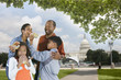 Photo: African American family eating hot dogs on vacation African American family eating hot dogs on vacation