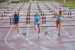 Runners crossing finish line in race