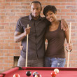 African American couple playing pool