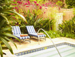 Lounge chairs next to hot tub
