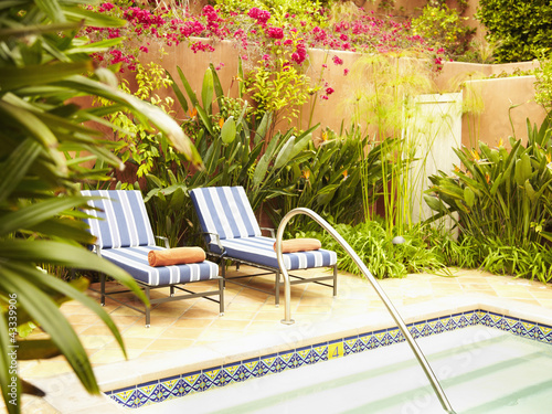 Photo: Lounge chairs next to hot tub Lounge chairs next to hot tub