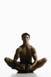 Caucasian man sitting on floor stretching