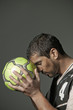 Serious athlete holding soccer ball