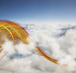 Colored cables swirling through clouds