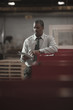 Black businessman using digital tablet in warehouse