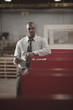 Black businessman using digital tablet in warehouse
