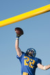 Caucasian football player catching ball