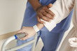 Photo: Nurse helping patient use walker in hospital Nurse helping patient use walker in hospital